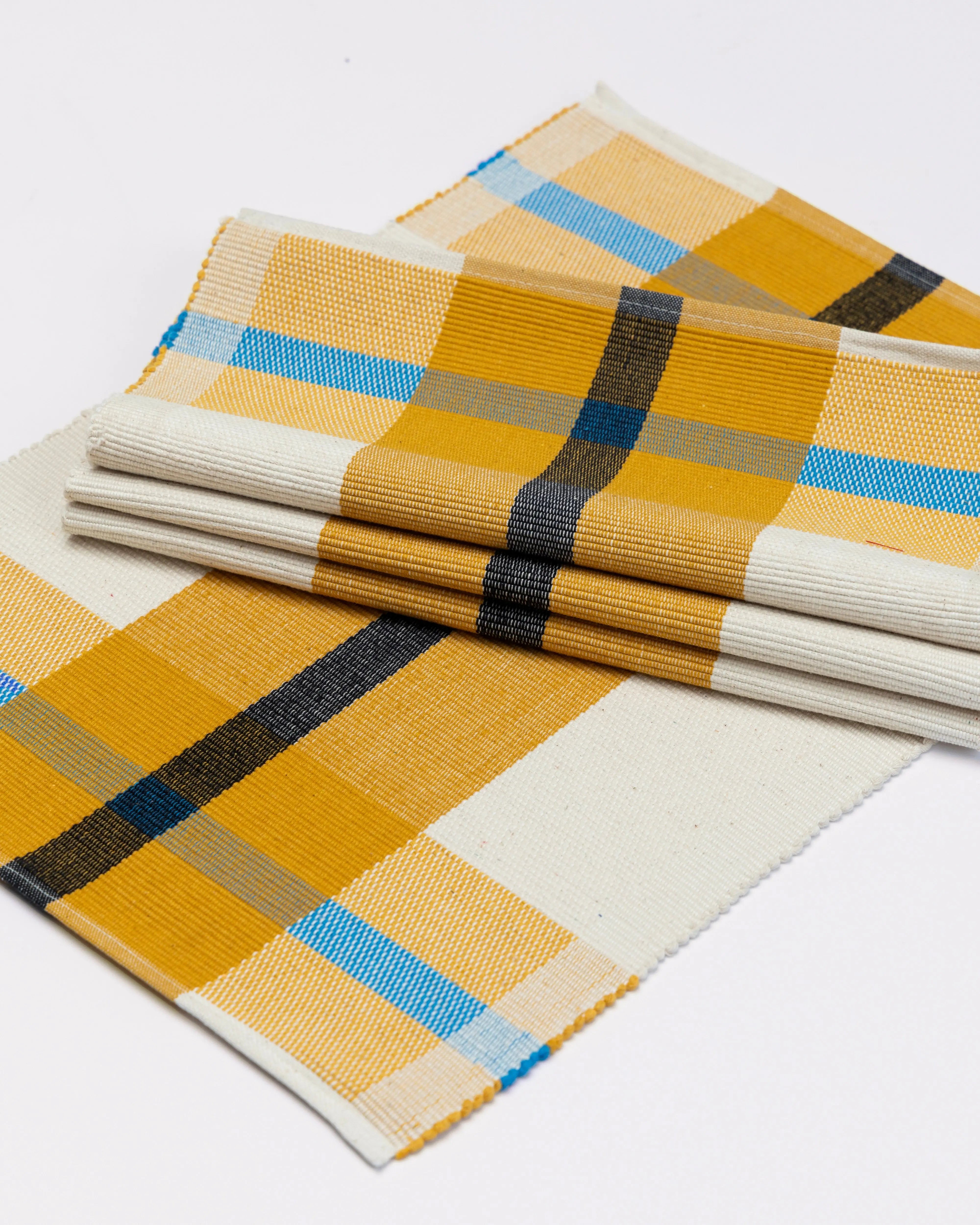 Handwoven ribbed weave placemat in yellow, black blue, and cream cotton, with stripe pattern - artisan crafted and durable