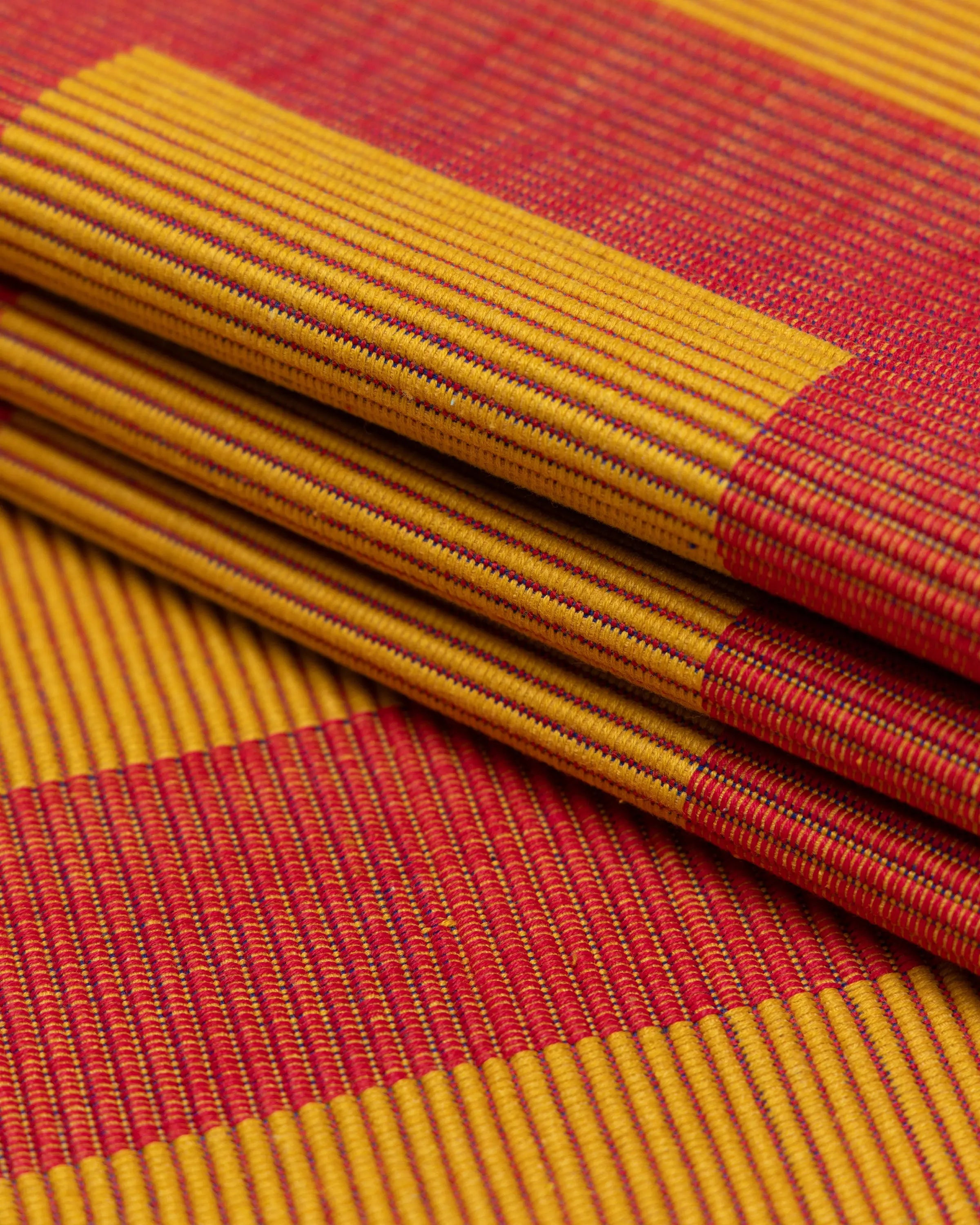 Close-up of red and yellow handmade placemat