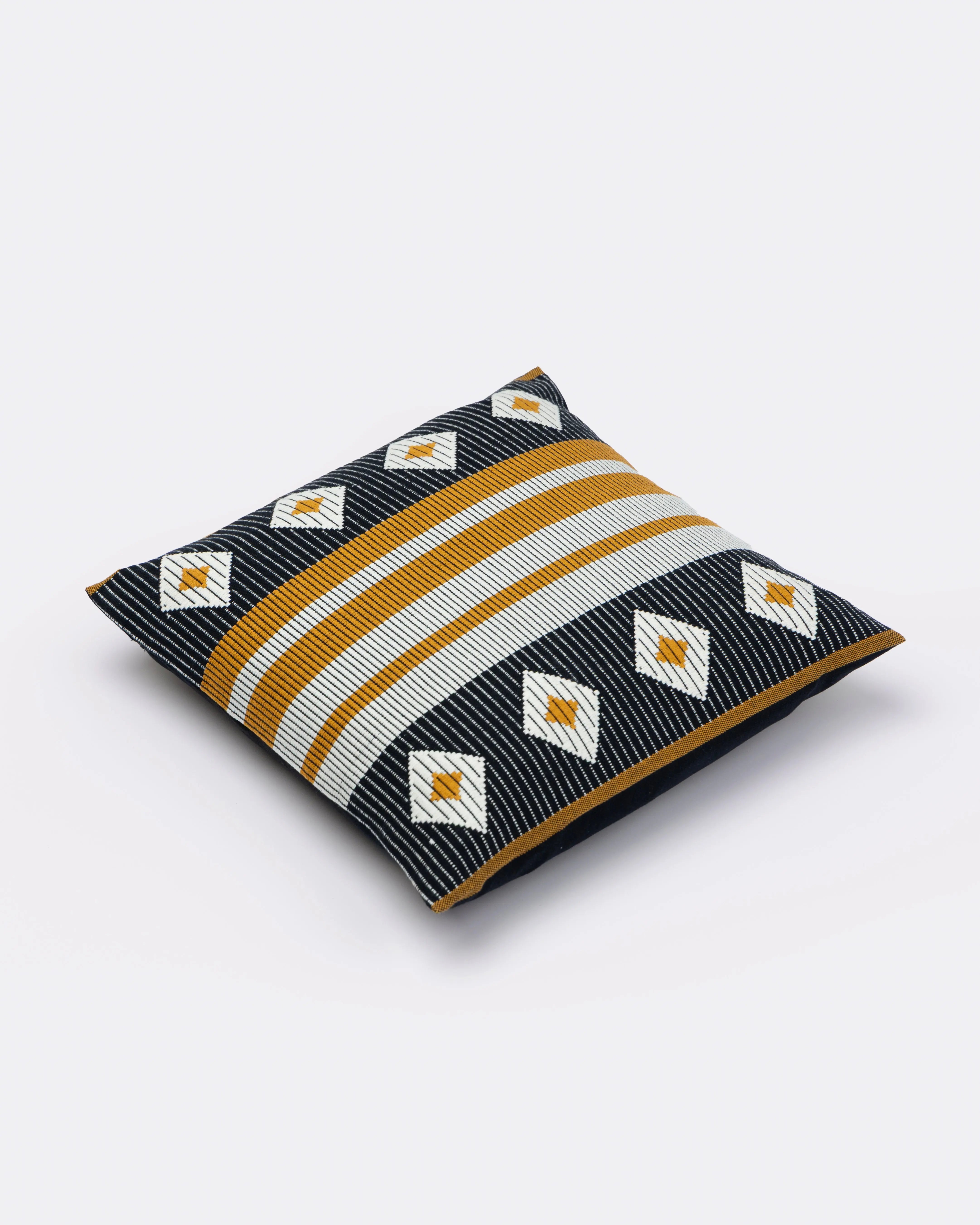 Decorative handmade cotton pillow with geometric pattern on a white background